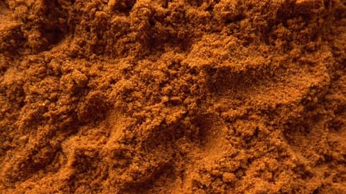 Close Up of Bright Orange Powdered Spice