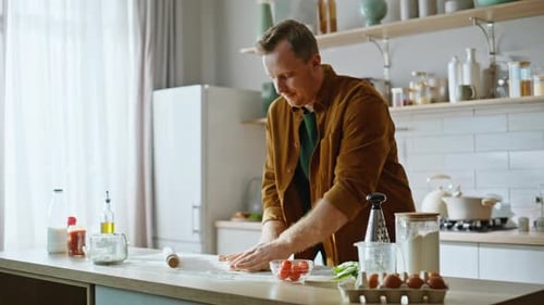 Focused Man Rolling Dough Kitchen Counter Involved in Culinary Process Closeup