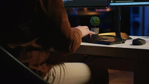 Software Engineer Typing on Keyboard Buttons Writing Lines of Code Close Up