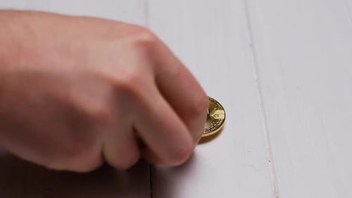 Spinning and Stacking Cryptocurrency Coins on White Surface