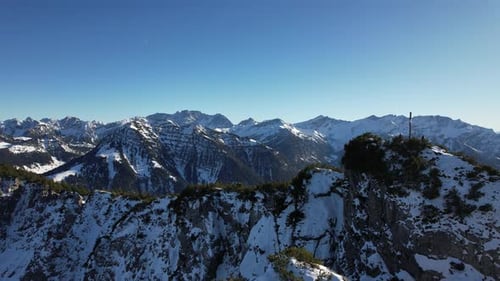 Areal shot flying sidways with a stunning view of the mountains of Liechtenstein. Perfect weather co