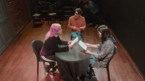 Two Actresses Having a Rehearsal with Stage Director in a Theater