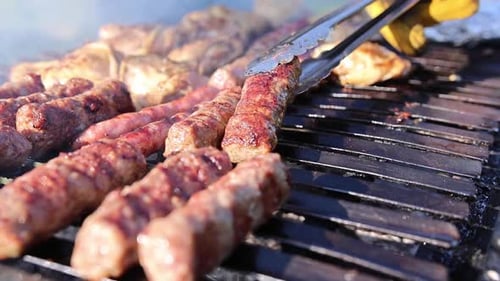 Sausages and Meats Sizzle on the Grill