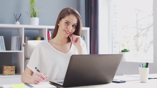 Young Woman Works at Home Office Using Computer Workplace of Female Entrepreneur Freelancer or