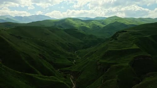 Aerial View of River Surrounded By Mountains and Hills