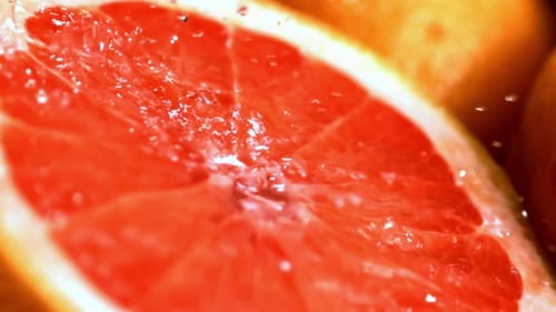Close Up of Grapefruit with Water Sprays