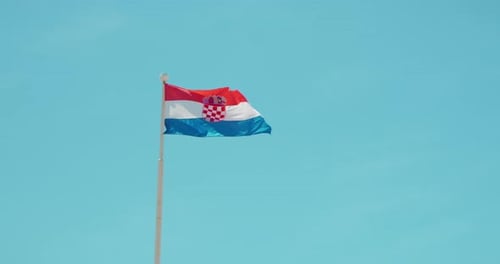 Croatian Flag Waving Against Blue Sky