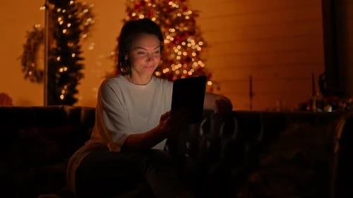 Brunette Talking Smiling Remote Meeting Sitting on the Sofa