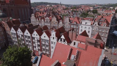 Drone Flight Across the Old Town Tiled Roofs in the Center of Gdansk Poland