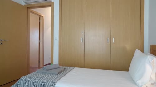 Cozy Traditional Bedroom with Wardrobes and a Bed in a Hotel for Relaxing and Sleeping