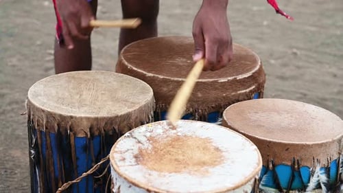 African Street Musician Playing Drums