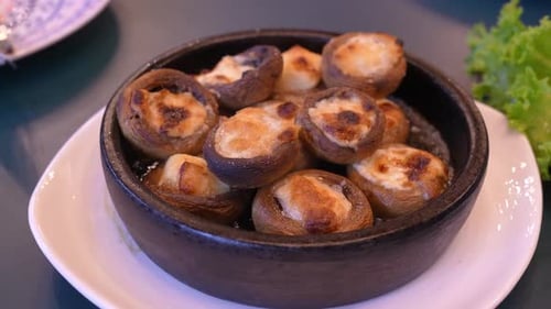 Rotating baked mushrooms with cheese appetizer