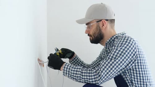 Man Working on Electrical Wiring in Home