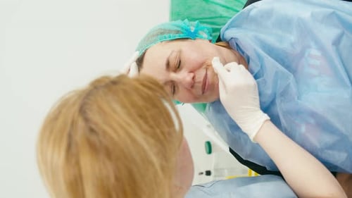 Relaxed Patient Speaking to Healthcare Professional in Hospital