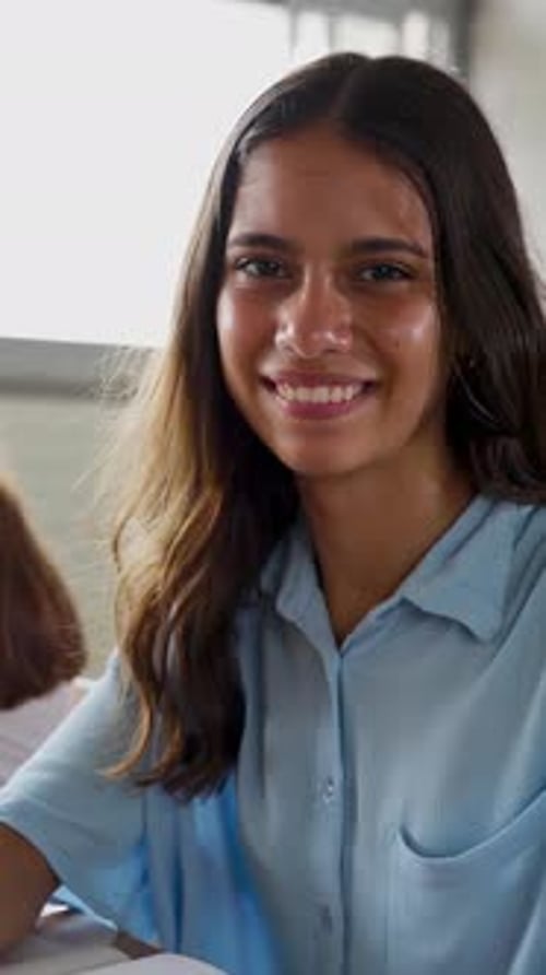 Smiling Young Woman in Classroom Portrait