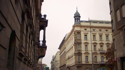 Urban street lined with historic buildings facades windows and classic architectural details