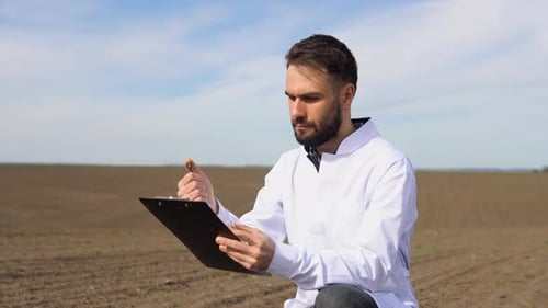 Scientist Checks the Quality of the Soil for Control Soil Quality Before Seed Plant Future