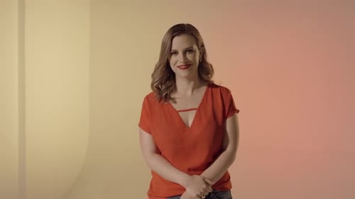 Smiling Woman in an Orange Shirt