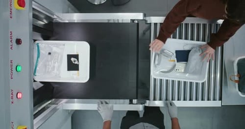 Top View on Diverse People Passengers Putting Personal Items in Plastic Trays for Screening