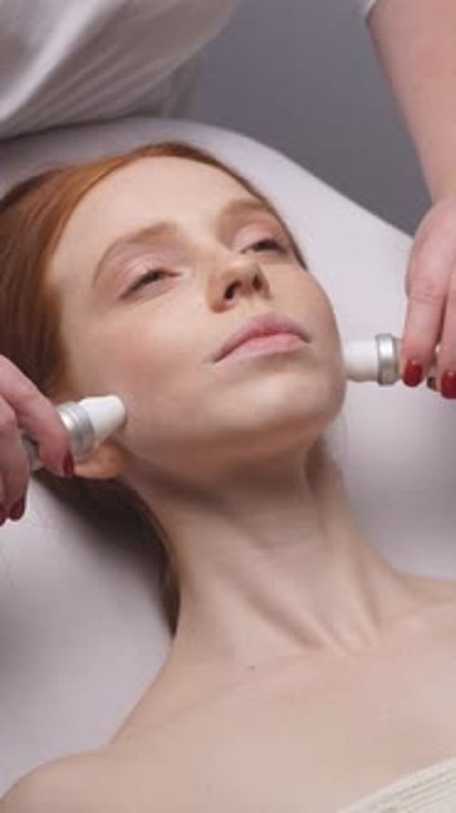 Woman Receiving Facial Treatment at Spa