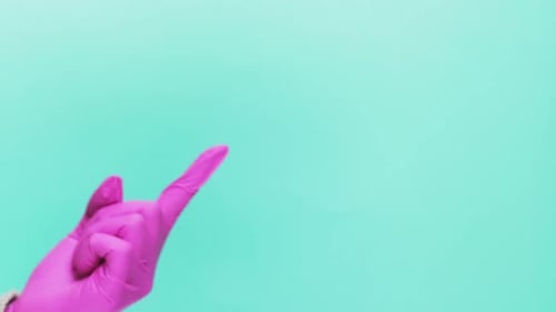 Hand Presents a Wrapped Gift with Red Ribbon