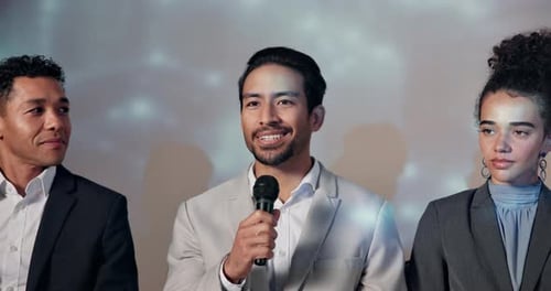 Confident Business Professionals Speaking at Press Conference