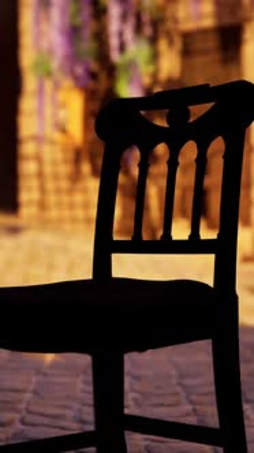 A Wooden Chair Sitting on Top of a Brick Floor