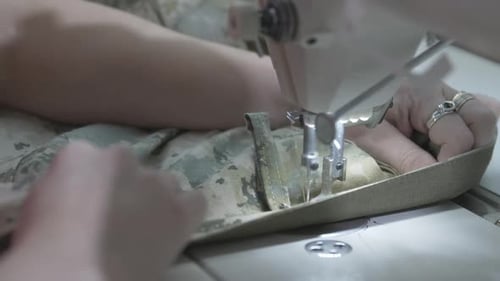 Camouflage Fabric Being Sewn By Machine Close Up