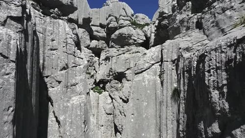 The Drone Rises Up to Show the Fantastic Karst Formations and Rock Faults on the Tresteni Vrh