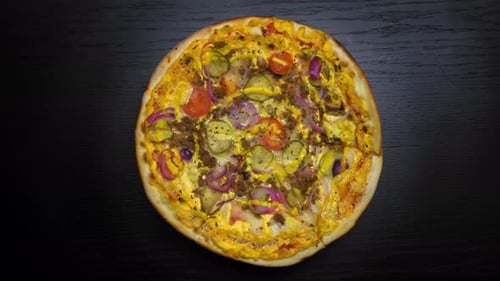 Top view of fresh baked pizza with tomatoes and cheese mozzarella rotate on tray