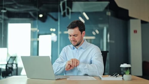 Close Up of Sick Businessman Holding Painful Wrist Due to Carpal Tunnel Syndrome