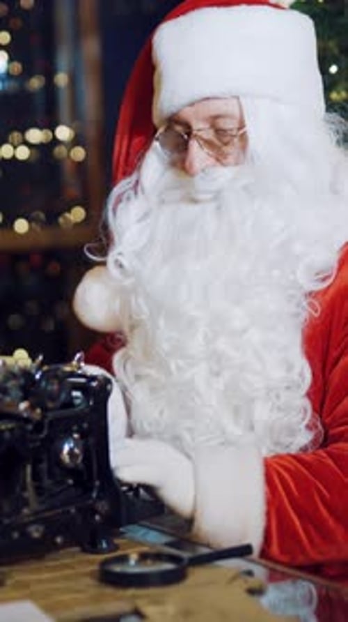 Santa Claus Typing Letters at Desk