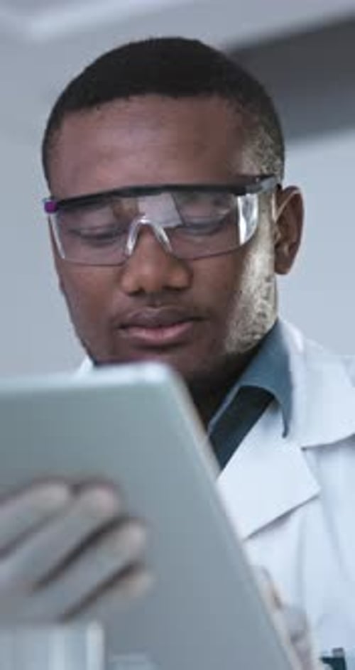 Tablet, science and research with black man in laboratory for medical, healthcare