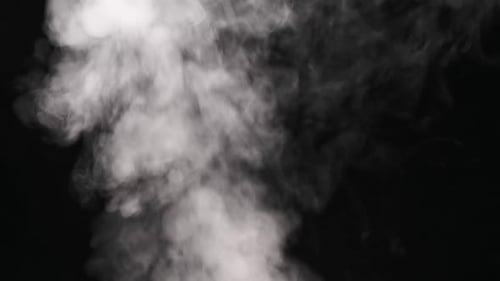 Atmospheric White Smoke Flowing Against Black Background