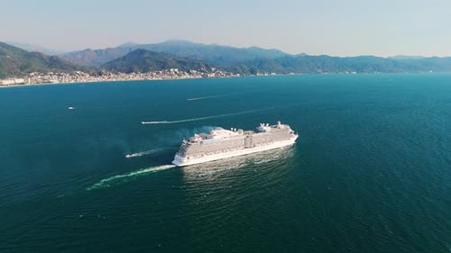 Huge cruise ship passing close to small yachts in puerto vallarta, mexico