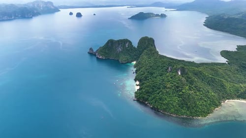 Aerial drone shot of a beautiful island in palawan in phillipines. Orbit shot of the island.