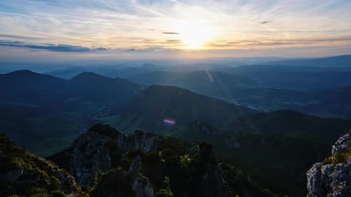 A Stunning Mountain Sunrise Captured Over a Serene and Picturesque Landscape Setting