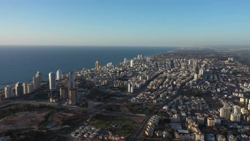 Aerial view of the city of Netanya and its coastline - part of the Israeli coastal plain, at sunset