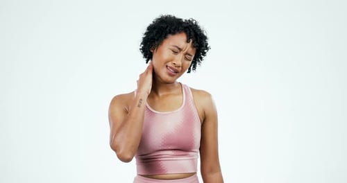 Neck pain, fitness and sports woman with injury in studio for health risk