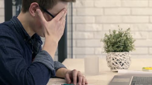 Teenager Studying and Experiencing Frustration