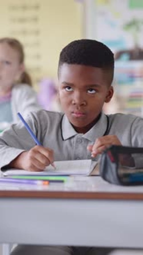 Boy, child and math test in classroom, counting fingers and kindergarten assessment for education