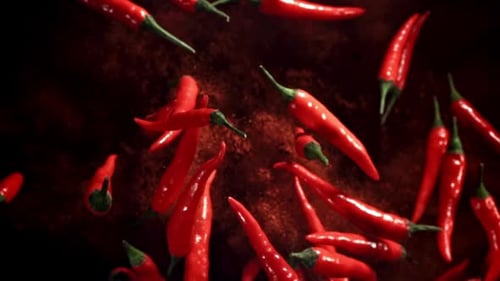 Flying Red Chili Peppers with Ground Pepper