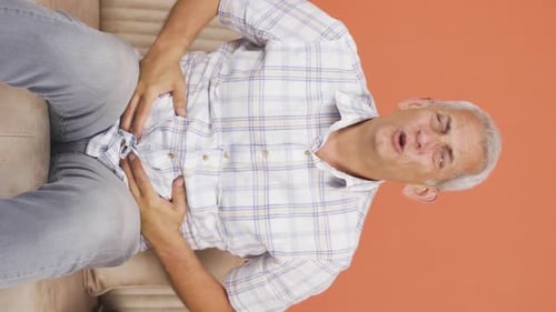 Vertical video of Man with stomachache.