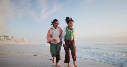 Lesbian couple, women and running on the beach, vacation and romance with happiness and playing