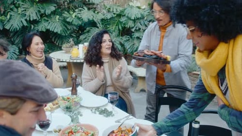 Friends Gather for an Outdoor Meal and Toast