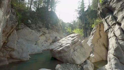 Gorgeous Rocky Terrain of the Canyon Stream and Massive Boulders and Cliffs