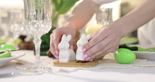 Setting Easter Table with Decoration of Bunny Figurines