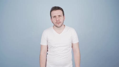Man looking at camera with curious expression.