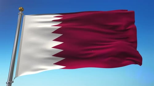 Waving Flag of Qatar Against a Clear Blue Sky