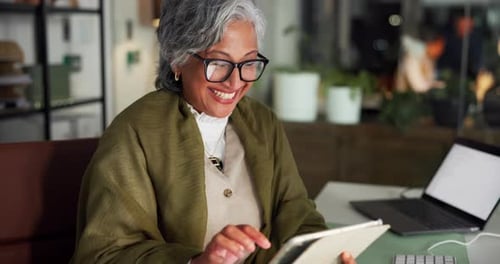Mature woman, tablet and happy at startup, night and review with app for article deadline at media